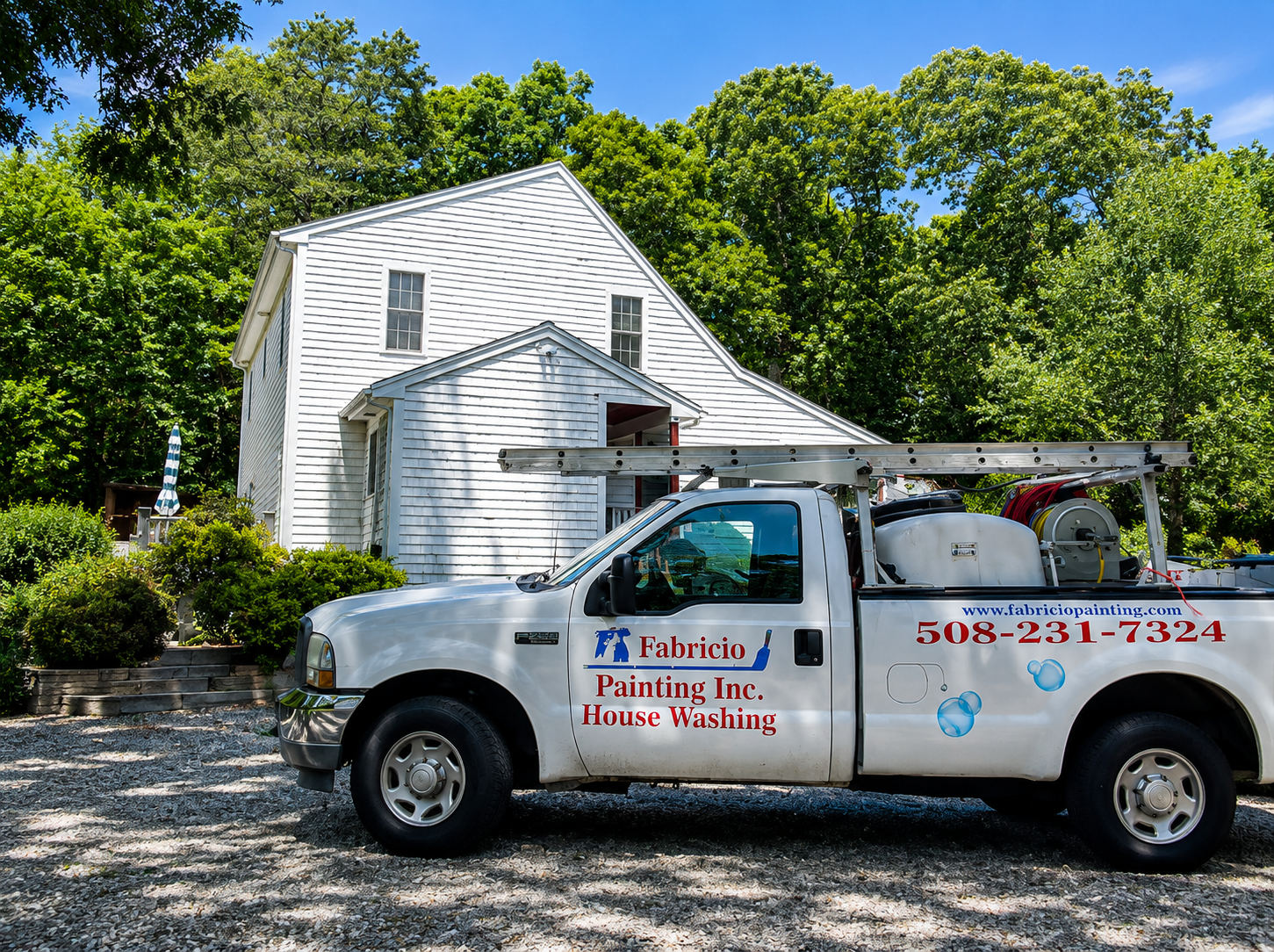 Fabricio Painting house washing truck in front of a Cape Cod home in South Dennis MA