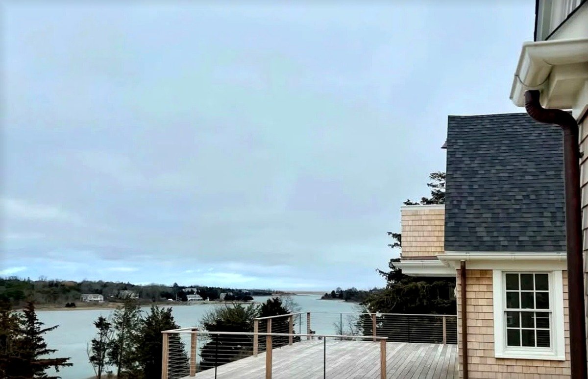 Deck staining on a Cape Cod home by Fabricio Painting